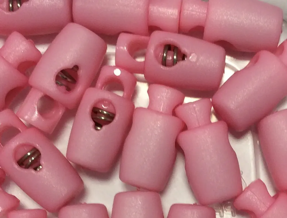 Kordelstopper rosa 1-Loch